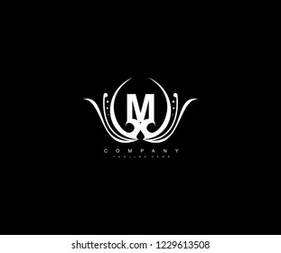 M letter linked monogram luxury rounded flourishes ornament logo