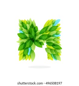 M letter logo formed by watercolor fresh green leaves. Brush stroke pattern. Vector ecology elements for posters, t-shirts and cards.