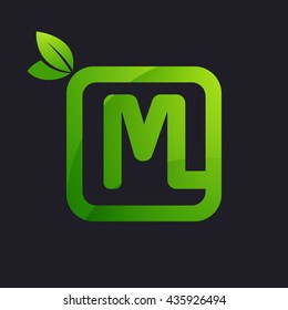 M letter logo in square and green leaves.