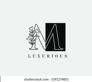 M Letter Luxury Vintage Logo. Minimalist M With Hand Drawn Leaves Shape design perfect for fashion, Jewelry, Beauty Salon, Cosmetics, Spa, Hotel and Restaurant Logo. 