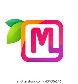 M letter in square with juice and green leaves. 