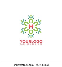 M letter trendy and elegant logo design. Vector floral shop or studio, wedding florist, custom. circle with flowers and leaves.