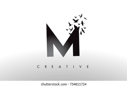 M Logo Letter with Flying Flock of Birds Disintegrating from the Letter. Bird Fly Letter Icon.