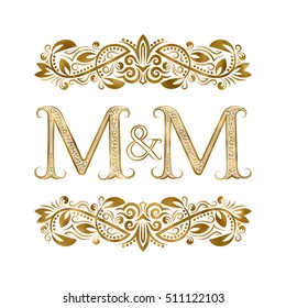 M and M vintage initials logo symbol. The letters are surrounded by ornamental elements. Wedding or business partners monogram in royal style.