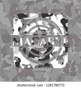 Macabre written on a grey camouflage texture
