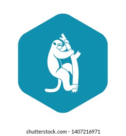 Macaque on a tree icon. Simple illustration of macaque on a tree vector icon for web