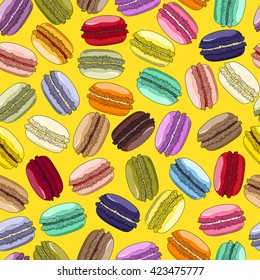 Macaroons seamless pattern. French sweet macaroons. Desserts on yellow background. Hand drawn pattern. Can be used for menu, in food industry, for posters, 