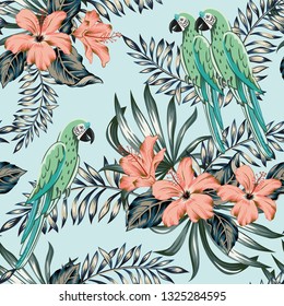 Macaw green parrots, palm leaves, pink hibiscus flowers, light blue background. Vector floral seamless pattern. Tropical illustration. Exotic plants, birds. Summer beach design. Paradise nature