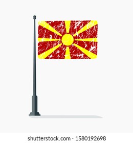 Macedonia flag with scratches on flagpole with shadow in vector