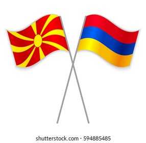 Macedonian and Armenian crossed flags. Macedonia combined with Armenia isolated on white. Language learning, international business or travel concept.