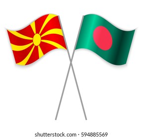 Macedonian and Bangladeshi crossed flags. Macedonia combined with Bangladesh isolated on white. Language learning, international business or travel concept.