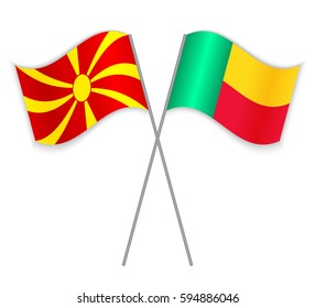 Macedonian and Beninese crossed flags. Macedonia combined with Benin isolated on white. Language learning, international business or travel concept.