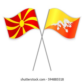 Macedonian and Bhutanese crossed flags. Macedonia combined with Bhutan isolated on white. Language learning, international business or travel concept.