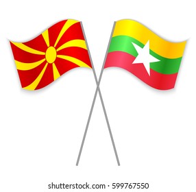 Macedonian and Burmese crossed flags. Macedonia combined with Myanmar isolated on white. Language learning, international business or travel concept.