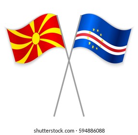 Macedonian and Cabo Verdean crossed flags. Macedonia combined with Cape Verde isolated on white. Language learning, international business or travel concept.