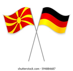 Macedonian and German crossed flags. Macedonia combined with Germany isolated on white. Language learning, international business or travel concept.
