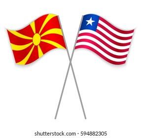 Macedonian and Liberian crossed flags. Macedonia combined with Liberia isolated on white. Language learning, international business or travel concept.