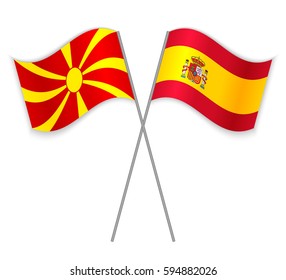 Macedonian and Spanish crossed flags. Macedonia combined with Spain isolated on white. Language learning, international business or travel concept.