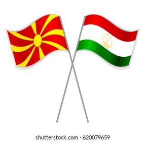 Macedonian and Tajikistani crossed flags. Macedonia combined with Tajikistan isolated on white. Language learning, international business or travel concept.