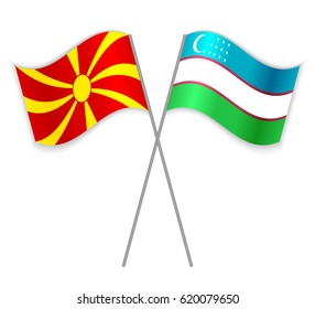 Macedonian and Uzbek crossed flags. Macedonia combined with Uzbekistan isolated on white. Language learning, international business or travel concept.