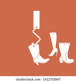 Machine arm manipulating several boots
