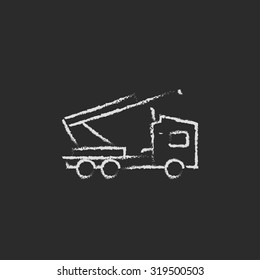 Machine with a crane hand drawn in chalk on a blackboard vector white icon isolated on a black background.