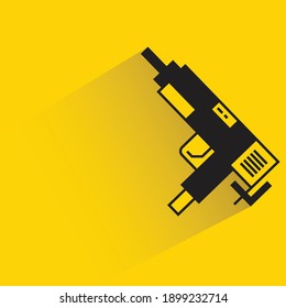 machine gun with drop shadow on yellow background