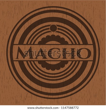 Macho wooden emblem