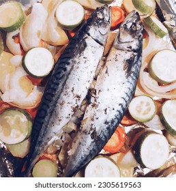 Mackerel with vegetables. The food is prepared for baking.