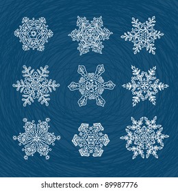 Macro-structure of real snowflakes, transformed and drawn as ornamental usable shapes. Set of nine forms.