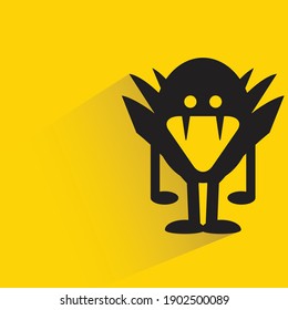 mad monster with shadow on yellow background