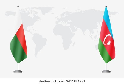 Madagascar and Azerbaijan flags for official meeting against background of world map.