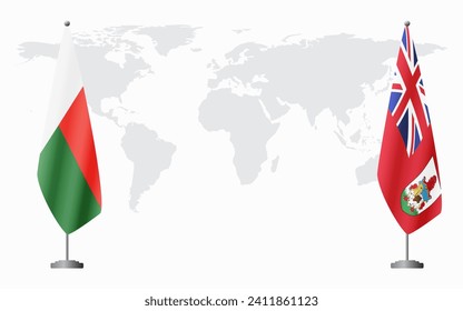 Madagascar and Bermuda flags for official meeting against background of world map.