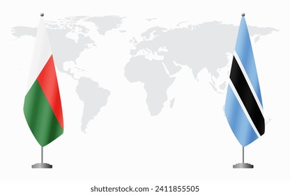 Madagascar and Botswana flags for official meeting against background of world map.