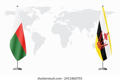 Madagascar and Brunei flags for official meeting against background of world map.