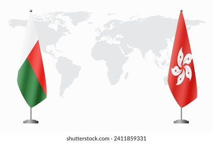 Madagascar and Hong Kong flags for official meeting against background of world map.
