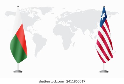 Madagascar and Liberia flags for official meeting against background of world map.