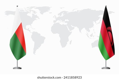 Madagascar and Malawi flags for official meeting against background of world map.