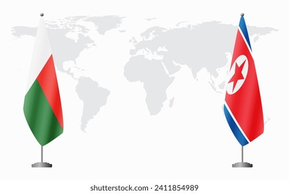 Madagascar and North Korea flags for official meeting against background of world map.
