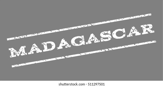Madagascar watermark stamp. Text tag between parallel lines with grunge design style. Rubber seal stamp with dirty texture. Vector white color ink imprint on a gray background.