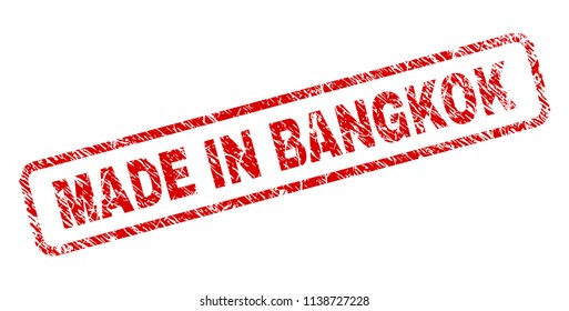 MADE IN BANGKOK stamp seal print with distress style. Red vector rubber print of MADE IN BANGKOK text with grunge texture. Text tag is placed inside rounded rectangle frame.