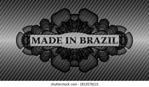 Made in Brazil text inside Currency carbon fiber dark emblem. Polymer texture handsome background. Artistic illustration. 