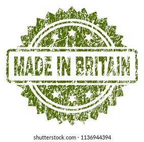 MADE IN BRITAIN stamp seal watermark with rubber print style. Green vector rubber print of MADE IN BRITAIN caption with grunge texture.
