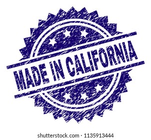 MADE IN CALIFORNIA stamp seal watermark with distress style. Blue vector rubber print of MADE IN CALIFORNIA title with scratched texture.