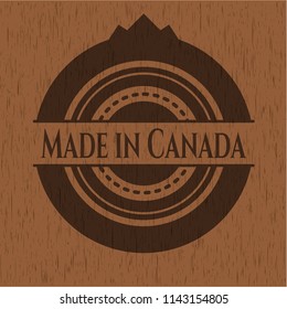 Made in Canada badge with wooden background