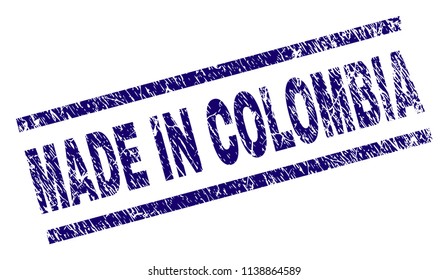 MADE IN COLOMBIA stamp seal watermark with grunge style. Blue vector rubber print of MADE IN COLOMBIA tag with grunge texture. Text tag is placed between parallel lines.