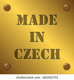 made in Czech text on gold metal plate with bolts in corners, Golden texture