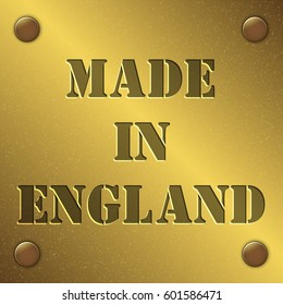 made in England text on gold metal plate with bolts in corners, Golden texture