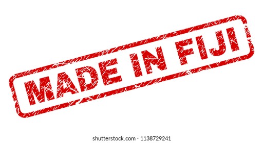 MADE IN FIJI stamp seal print with distress style. Red vector rubber print of MADE IN FIJI text with dust texture. Text caption is placed inside rounded rectangle frame.