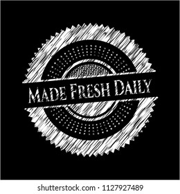 Made Fresh Daily chalk emblem written on a blackboard